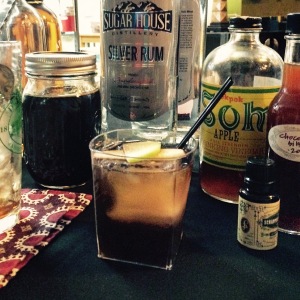 The Fall Fandango Silver rum, Applejack, stout beer syrup, cardamom & chocolate bitters, and apple Pok Pok